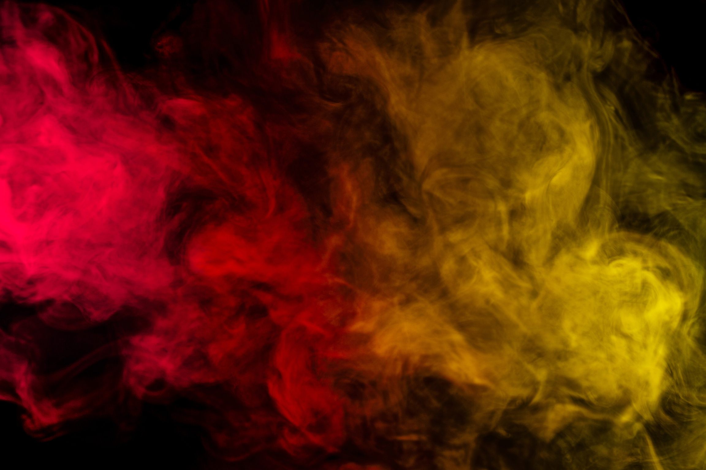 Abstract Red and Yellow Smoke Hookah on a Black Background.